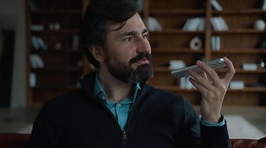 Successful serious Caucasian mature business man male businessman employer talking mobile phone saying smartphone using smart technologies dictate commands loudspeaker recording voice mail indoor room