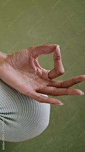 Yoga model zen fingers lying feet close up. Girl sitting lotus pose vertically