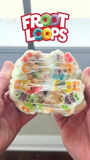 We’re Hungry on Instagram: "A Froot Loops cereal bar taken to another level🔥Full recipe below: -10 Marshmallows -1 Tbsp Butter -1 Cup Froot Loops -1/2 Cup Melted White Chocolate 1. Add the marshmallows and butter to a bowl. 2. Microwave for about 1 minute then give it a stir. 3. Add the Froot Loops to the bowl and mix to combine. Shape the mixture into a square. 4. Melt white chocolate and cover the cereal bar completely in the chocolate. 5. Freeze it for a few minutes until the chocolate sets.