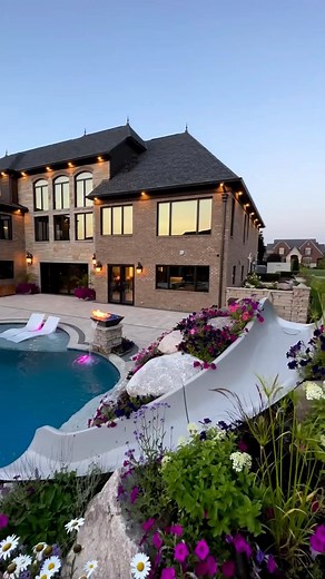 7.4K views · 49 reactions | The mastermind of landscape design, @antonellilandscape, has outdone himself once again. This recent project we’ve captured highlights a water slide garden, flame bowls, and a hot tub cascading into the pool.  @wayup_media Presenting the Landscape Sovereign: @antonellilandscape #pool #landscape #luxuryoutdoorliving #poolgoals #outdoorretreat #outdoorparadise #homes #realestate #luxury #houses #fascinatinghomes | Fascinating Homes | Facebook