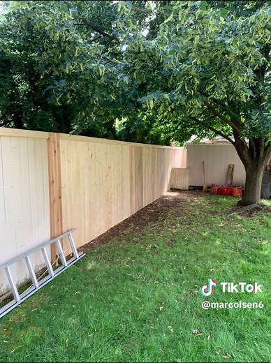How to attach a wooden fence to an ugly chainlink fence