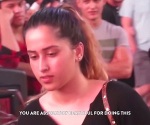 She invites strangers to shave her hair in public... credit: The Liberators International | VT