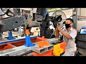 Mitsubishi light truck chassis straightening on job training on Celette frame machine and jig system