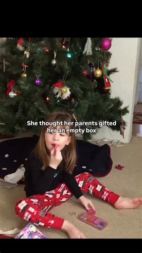 Brain Rewiring Network on Instagram: "This heartwarming Christmas clip shows a young girl sitting on the floor in festive pajamas as her father brings in a large, wrapped gift box beside the tree, setting up what looks like an ordinary holiday surprise. As she opens the box, a gray kitten suddenly jumps out and darts behind her, leaving her momentarily confused as she peers into the now-empty box. After her father gently prompts her to look behind her, she finally spots the kitten wandering near