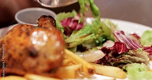 Woman eating burger and french fries