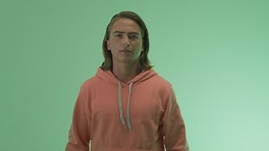 Man clapping his hands in approval on a green background - Free Stock Video