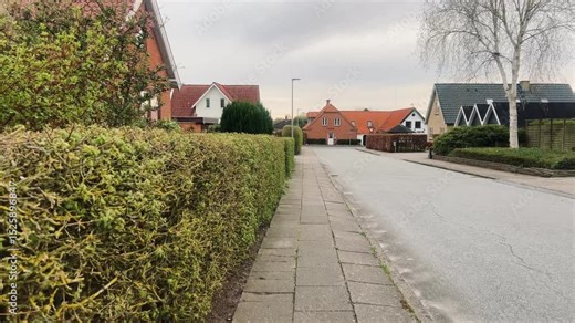 Street with old houses leading to the Domkirke church in Viborg, Denmark. The old city in Denmark. Traditional danish architecture. Midtjylland. Cityscape at dusk. Scandinavian street at sunset.