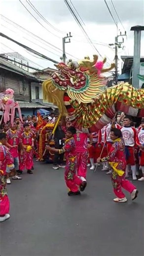 The Golden Dragon Troupe, disciples of Kleuawan, performing the water-pouring ceremony for Luang ...