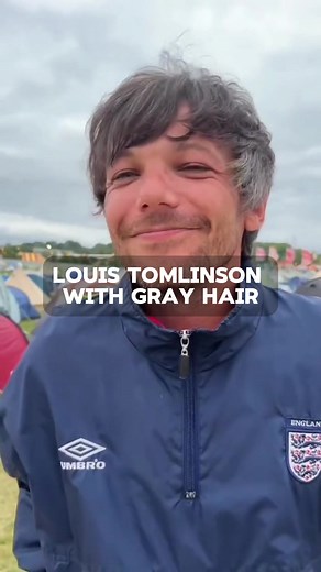 #OneDirection fans freak out after #LouisTomlinson embraced gray hair. The former One Direction member went viral over the weekend for sneaking in a TV at the Glastonbury Festival to watch England’s Euros match.