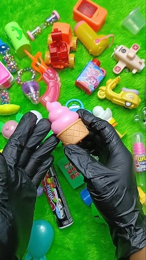 Asmr color balls and candy container whit pink ice cream