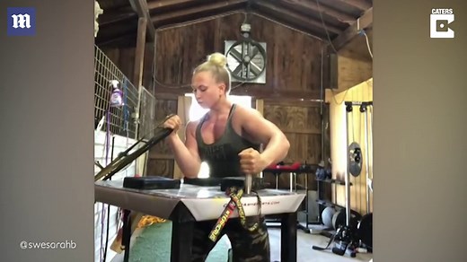 Video: Arm wrestler shows off her 'gun' power during intense work out | Daily Mail Online