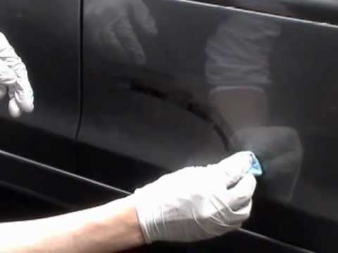 Repair scratched car door.