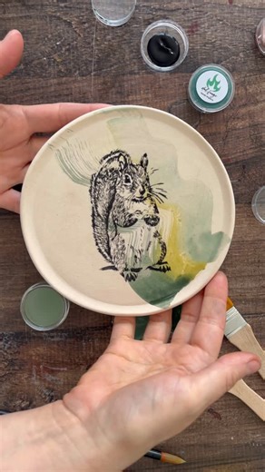 Love in Pottery on Instagram: "Armonía (@armonia.ceramica) is a ceramics studio based in Argentina—creating smooth bizcocho (bisque-fired) pottery in clay so potters, artists, and workshops can focus on painting, glazing, and turning ceramics into everyday art. Armonía showcases a mixed-technique process with friends: Herself provides the bisque pottery plate ready to decorate, Antes Del Fuego (@antes.delfuego) lays down watercolor-like washes and color on the clay surface, and Chablom Serigrafi