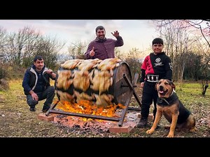 Mountain Chef's Wild Cooking: Chickens Roasting on a Rolling Barrel in the Wilderness