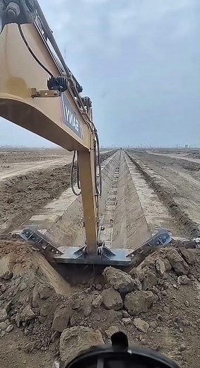 Excavator Equipped with a T Shape Bucket for One Pass T Shape Trench Formation