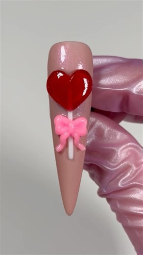 NAILZBYDEV.com on Instagram: "It’s less than a month away until 𝒱𝒶𝓁ℯ𝓃𝓉𝒾𝓃ℯ’𝓈 𝒟𝒶𝓎😍 We wanted to show you a cute and simple Heart Lollipop Tutorial to try out using our 𝐓𝐫𝐢𝐩𝐩𝐲 𝐆𝐞𝐥𝐬!❤️🍭 You can order all our 𝐍𝐀𝐈𝐋𝐙𝐁𝐘𝐃𝐄𝐕 products at the 🔗 in our bio!🛍️ Don’t forget to use your favorite affiliate code to save!💸✨ ❣️ #nails #nailtutorial #3dgel #3dart #nailzbydevshop #nailart #gel #valentinesdaynails #nailsofinstagram #lollipop ❣️"