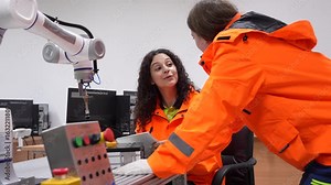 Engineering, worker woman Quality control, maintenance, check in factory, Workshop for factory operators, Robotics engineer Female worker in a modern automotive manufacturing plant.