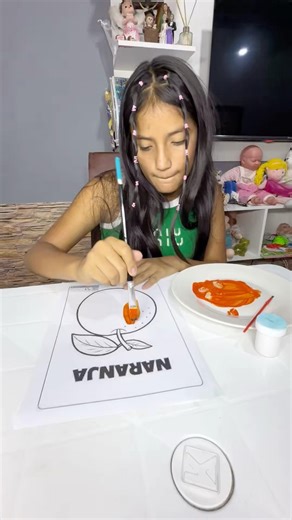 My aunt teaches me how to create the color orange.