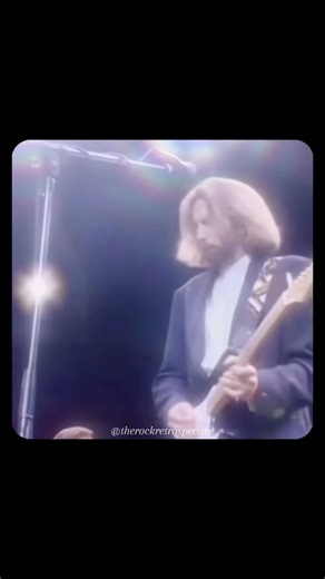 TheRockRetrospective on Instagram: "Eric Clapton – “Layla” (Live at Royal Albert Hall, 1991). Filmed during his legendary 24-night residency, this performance captures Clapton in full command — blues-drenched tone, stripped-down arrangement, and that iconic image: cigarette tucked into the strings of his Strat. No slide guitar here, just pure tension and soul as Layla takes on a heavier, more personal edge. A defining live moment in Clapton’s solo career."