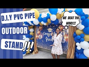 Outdoor set up of a PVC backdrop on a very windy day