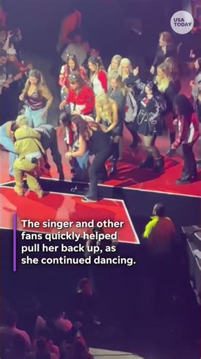 Fan at Machine Gun Kelly falls through stage gap. See London react.