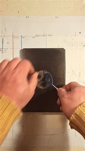 Peter Carael on Instagram: ". "Wrestling Mask" I did some more prints with the "Blue eye" found object. This time I made a composition that results in a sort of wrestling mask. Or maybe one of those faces you see on Maya temples? It's a haunting image, I think. I really like this print that is another example of pareidolia. FOUND OBJECT 260201 Gelplate monoprint Acrylic on A4 paper #art #printmaking #contemporary"