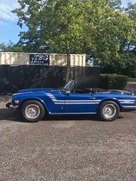 It's a 1976 "Delft Blue" Triumph TR6 Roadster (with Rubber Baby Buggy Bumpers!)