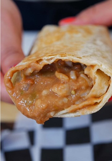 Homemade Bean burritos from scratch a Classic comfort food recipe that everyone loves These burritos are perfect for anytime meals Quick & Easy recipe that will have everyone asking for more. I hope this recipe helps you shine no matter the occasion 🤩 Ingredients: * Chicken thighs * Chicken fat - reserved from the thighs * 2 cups of pinto beans * 1 can of green chili * ¼ cup of green salsa * Onion * Serrano pepper * ½ long-grained parboiled rice * ¾ water * Chicken bouillon (or substitute with