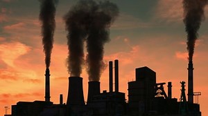 Smoking factory chimneys. Environmental problem of pollution of environment and air in large cities. View of large plant with Smoking pipes. Industry pipes pollute the atmosphere with smoke