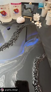 1.8K views · 11 reactions | Ever wanted to try your hand at resin flow art? Now’s your chance! @graphiq_design is hosting an all-new Resin Workshop where you’ll create your very own black resin and stone masterpiece on a wooden panel—just like this showstopper! Think cosmic swirls, bold textures, and that signature high-gloss finish. Get ready to have some fun! Saturday, July 26th, 2025 Spots are limited—DM @graphiq_design to reserve yours! | ArtResin | Facebook