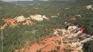 Aerial footage of Red sands and abstract Rustrel canyon moher cliffs landscape. Provencal Colorado near Roussillon,in the Vaucluse department - Southern France.
