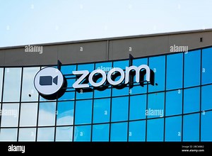Zoom sign and logo on startup headquarters in Silicon Valley. Zoom Video Communications is a company that provides remote conferencing services using Stock Photo - Alamy