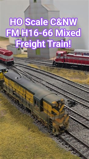 HO Scale C&NW FM H16-66 Mixed Freight Train Runs by Grain Elevator & Silo!