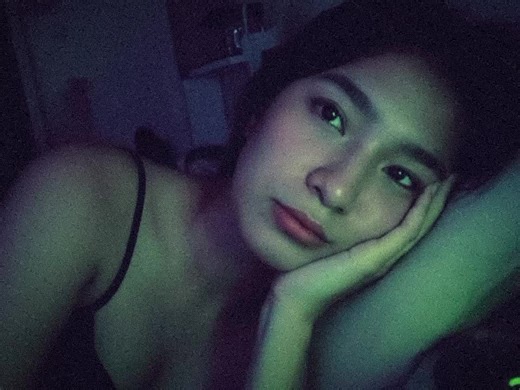 Late-Night Reflection: A Dimly Lit Intimate Moment