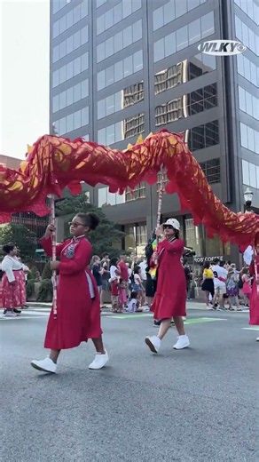 Nearly 1,000 people take part in World of Cultures Parade at WorldFest