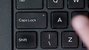 Free stock video - Top view finger pushing caps lock button keyboard