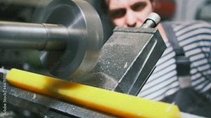 Close-up. A milling cutter on a horizontal milling machine processes a polyurethane part according to a drawing or a sample at the factory. Milling machine during work