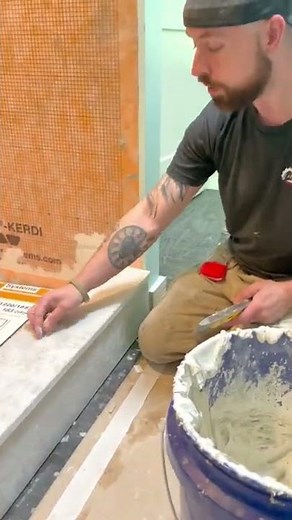 How to install a marble shower curb to allow for proper drainage. #tile #tileinstallation #shower