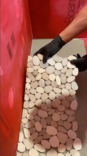 Pebble shower floor install #tile #diy #construction #stone