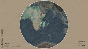 Madagascar and its capital circled and zoomed on the global physical map in the van der Grinten I projection with animated oblique transformation. Animation 3D