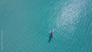 Beautiful cinematic aerial view of the Bahamas island - turquoise oceans, water sports sailing, beach walks, water bikes