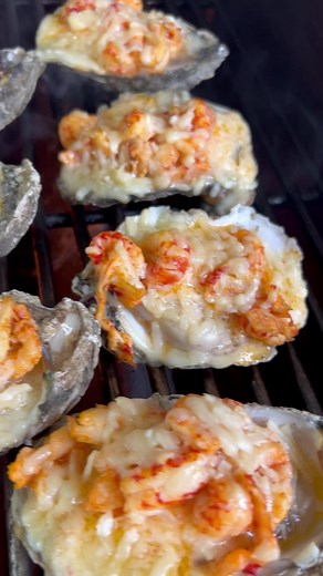 My Oysters Bayou takes beautiful gulf oysters and grills them over an open flame with Louisiana crawfish tails, after-the-boil crawfish butter and fresh grated Parmesan cheese! Recipe avaialble now: https://boudreauxsbackyard.com/recipes-1/f/oysters-bayou | Boudreaux’s Backyard