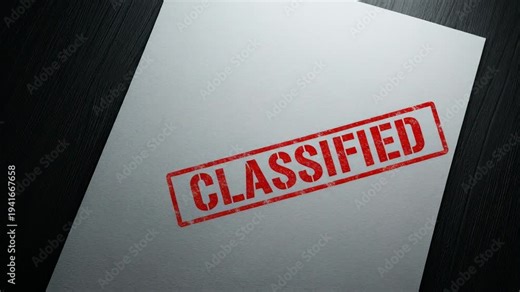 Classified rubber stamp on white paper document. Secret information marking and restricted access concept. Confidential military project and intelligence report file.