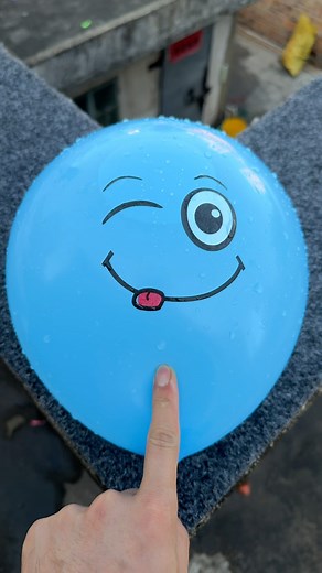 Experiment: Will a water balloon explode if it rolls down a tall building? 💥🎈 #balloon