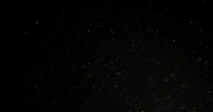 Download Dust Particles in motion in black screen. filmed with RED camera. for free