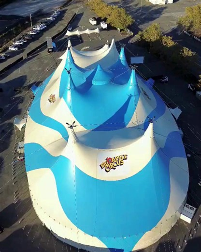 🎪✨ A bird’s-eye view of the magic in Suffolk Downs! The Big Apple Circus tent stands tall, ready to bring jaw-dropping performances. From the sky to your seat, this iconic tent is where memories are made. 🌟🎭 🎟️ The show has begun! Grab your tickets now and join us for an unforgettable experience under the big top! 🎟️ Eventim USA #BigAppleCircus #UnderTheBigTop #CircusMagic #DroneFootage #Boston #SuffolkDowns #Big #Apple #Circus #FamilyFun #Magic #Tent | Big Apple Circus