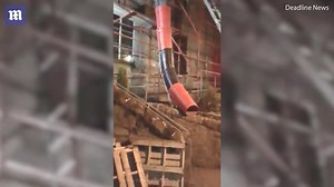 Daredevil takes 30ft ride in building site's rubbish chute