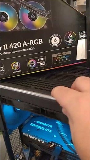 Installing a giant Arctic Liquid Freezer II 420 liquid cooling system on top of a Lian Li LanCool...