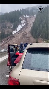 Mudslide Rushes Onto Mountain Bridge, Forcing People to Run for Safety in Alaska Video captured near a mountain roadway shows a sudden mudslide cascading down a hillside and spilling onto a bridge where several cars were parked. The footage shows thick mud, rocks, and debris surging onto the roadway within seconds, quickly surrounding vehicles and cutting off access across the bridge. As the slide intensifies, people can be seen abandoning their cars and running to safer ground, scrambling away 