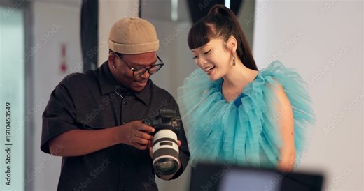 Man, photographer and talking to model with camera, review pictures and results of photoshoot. People, discussion and check equipment for photography, feedback and pose guidance for fashion magazine